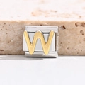 Macro shot of gold letter W charm link for Italian modular stainless steel bracelet - Letter W