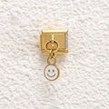 Close-up of golden stainless steel modular charm with a white enamel smiley face pendant - White Smiley Style (GMKDZ-686)