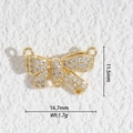 Vue macro d'un pendentif nœud doré serti de zircons blancs pour la création de bijoux DIY - Nœud Papillon 3 Anneaux DIY (DZ-3227)