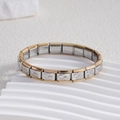 Detail view of gold and silver stainless steel modular bracelet with heart engravings - Solid Double Heart Gold Edge (BD-236)