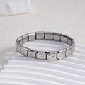 Detailed macro shot of modular stainless steel bracelet with double heart embossed charms - Solid Double Heart Silver (BD-239)
