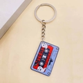 Retro cassette keychain featuring Let's Get Spooky design and ghosts on red acrylic - Halloween Ghost Cassette Style (G)