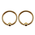 Detail shot of a pair of gold-plated captive bead rings with polished mirror finish - 8mm / Gold