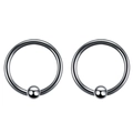 Close-up of a pair of polished stainless steel captive bead rings with silver finish - 8mm / Steel