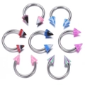 Macro detail of stainless steel horseshoe nose rings with colorful striped acrylic spikes - B# Spike Head Horseshoe Ring / 10 Pieces/Pack (1.2*8*3)