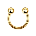 Detail of a 4mm gold-plated stainless steel circular barbell for body piercings - Ball-Gold