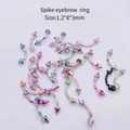 Detailed view of multi-color splatter paint spike eyebrow rings in 1.2x8x3mm size - Curved Spike Eyebrow Ring (JE0099B) / 10 Pieces Pack / Multicolor