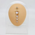 Silver belly button ring featuring four graduated white heart-shaped crystal pendants - Four Linked Hearts Dangle Style (JE0172B)