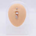 Silver stainless steel belly ring with a zircon-studded leaf pendant on a skin model - Silver Leaf Pendant Style (JE0430J)
