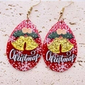 Detail of red teardrop Christmas earrings with snowflake and Christmas text on sandstone - Christmas Bell