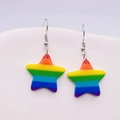 Macro shot of colorful rainbow acrylic star earrings with glossy resin finish on white ceramic - Rainbow Star Style (JE0918F)
