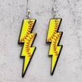 Close-up of yellow acrylic lightning bolt earrings with red baseball stitching patterns - Softball Style (JE0991A)
