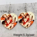 Detail view of heart-shaped acrylic earrings with retro Halloween graphics and dimensions - Vintage Halloween Illustration (JE1059C)