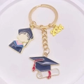 2024 graduation keychain with blue gown, mortarboard charm and golden metal ring - 2024 Year Cartoon Figure Scroll Hat Style (JE1308H)