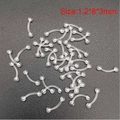 Macro detail of bulk transparent acrylic curved eyebrow rings sized 1.2x8x3mm - Round Top Eyebrow Ring / 1 Piece