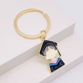 Detail view of cartoon enamel graduation keychain with golden ring and academic cap charm - Graduate Character Academic Dress Style (JE1364J)