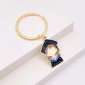Detail of cartoon girl charm with blue graduation gown and golden alloy keychain - Graduate Girl Dark Blue Gown Style (JE1364I)
