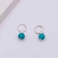 Silver hoop earrings featuring turquoise bead pendants with natural black vein textures - Round Turquoise Pendant Style (JE1355B)