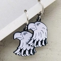 Detailed view of vintage black-plated eagle head earrings with white enamel finish. - Eagle Style (JE1548F)