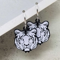 Close-up of black and white tiger head earrings with polished silver hoop dangles - Tiger Head Style (JE1548A)