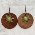 Detail of round wooden earrings featuring vintage gold sunburst patterns on dark wood - Bronze Sunbeam Style (JE1542F)