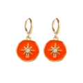 Detailed view of orange enamel hoop earrings with golden starburst and central crystal - Orange Star Round Style (JE1572C)