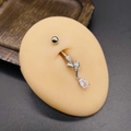 Macro detail of silver navel ring with crystal bow and pear-shaped zircon drop - Bow Pear Shape Style (JE1616L)