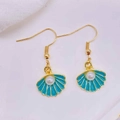 Detail of gold shell earrings with blue enamel, starfish motif and white pearl inlay - Lake Blue Shell With Artificial Pearl (JE1614P)