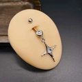 Macro detail of stainless steel belly button ring with star pendant and blue moonstone - Silver Vintage Moonstone Star Style (JE1230E)