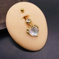 Macro detail of gold-plated belly piercing with iridescent opal heart pendant on skin mold - Gold Purple Opal Heart Style (JE1615C)