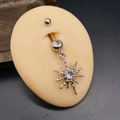 Detail of surgical steel belly ring featuring a sparkling star pendant and opal stone - Silver Opal Starburst Style (JE1615D)