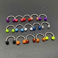 Close-up of 15 colorful horseshoe piercing rings with vibrant acrylic beads on dark background - A# Solid Color Round Head Horseshoe Ring