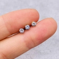 Three small round-cut cubic zirconia studs in silver and gold-tone claw settings - Round Solitaire Shape (JE0135)