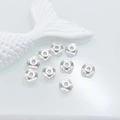 Macro shot of silver heart spacer beads with radial texture for DIY jewelry making - Wave Edge 10*3mm / White Gold