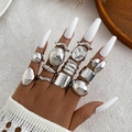 11-piece set of silver chunky lava and textured rings shown on a hand in boho style - Style (HS2032-17)