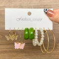 Set of 6 gold butterfly earrings and acrylic hoops on display card with wood background - Gold Green Pink Butterfly Pearl Hoop Style