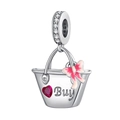 Macro detail of silver shopping basket charm with red heart gem and pink enamel bow - Red Heart Shopping Basket (DUT241)