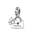 Detailed close-up of S925 silver shopping bag charm with heart gemstones and bow - Shopping Bag Style (DUT163-G)
