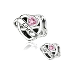 Macro shot of silver heart charm with pink gemstone and Forever Love engraving - Love Forever Pink Stone Heart (CCT968)