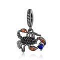 Macro shot of black scorpion pendant with inlaid orange and blue zircon stones - Scorpion (CCT199)