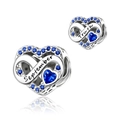 Macro detail of silver heart charm with September engraving and blue zircon stones - September-Truth (DUT19-9)