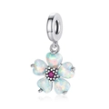 Macro detail of silver flower charm featuring iridescent opal petals and a pink gemstone - Five-Petal Flower Iridescent (CCT337)