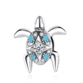 Macro detail of a silver sea turtle charm with blue enamel shell and inlaid white zircon - Turtle Style (CCT121)