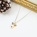 Detailed view of reindeer pendant necklace with white enamel and purple crystals - White Enamel Reindeer (W1622)