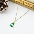 Golden Christmas tree necklace with green enamel pendant on a festive white background - White Star Green Christmas Tree (W1639)