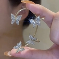 Golden butterfly ear cuff with sparkling rhinestones shown on ear as a variant option - Left Ear / Gold Butterfly (3#)