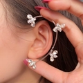 Macro detail of silver bee ear cuff with sparkling zircons worn on ear for non-pierced ears - Left Ear / Silver Bee (26#)