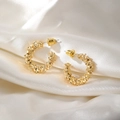 Detailed close-up of golden C-shaped earrings with textured surface on white silk fabric - C-Shape Grain Texture Style (HS1930-Gold-6)