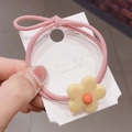 Detalle de una goma para el pelo rosa con flor amarilla en tarjeta de presentación - Cuerda Rosa Con Flor Amarilla (HS920-2)