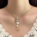 Golden double heart tassel necklace with angel pendant and pearls on elegant model - Gold Angel Heart Artificial Pearl OT Buckle Necklace (HS1879-3)